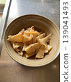 Simmered seasonal bamboo shoots, served in a small bowl. Simmered seasonal bamboo shoots, served in a small bowl. 139041493