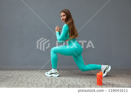 Beautiful  fit woman stretching. Woman working out on steps outdoors. 139041611