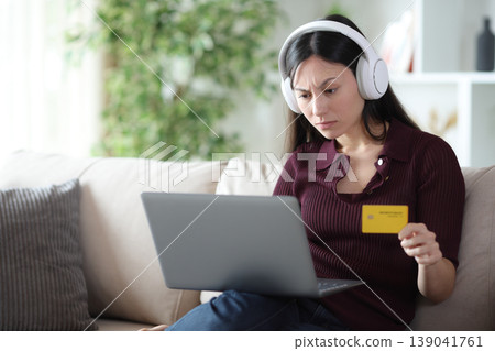Suspicious asian woman trobled buying online at home Suspicious asian woman trobled buying online at home 139041761