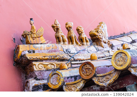 Close-up on mysterious animals on the palace roofs of the Forbidden City in Beijing that symbolizes rank and position 139042024