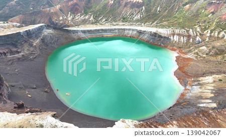 The breathtaking view of Okama Crater Lake in Zao, with its beautiful emerald green surface. 139042067