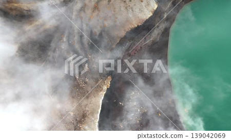 An abstract drone view of the crater lake shore and the mist. 139042069