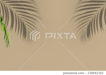 An aesthetic beige wall background featuring soft tropical palm leaf shadows and a touch of green foliage. Ideal for product mockups, summer designs, and minimalist presentations An aesthetic beige wall background featuring soft tropical palm leaf shadows and a touch of green foliage. Ideal for product mockups, summer designs, and minimalist presentations 139042165