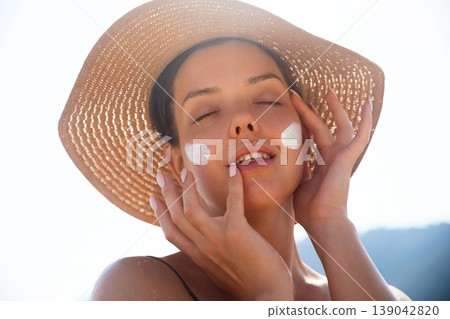 Attractive Woman With Sunscreen On Face And Closed Eyes At Beach. Beauty Skincare Concept. Female Enjoying Summer Sun Attractive Woman With Sunscreen On Face And Closed Eyes At Beach. Beauty Skincare Concept. Female Enjoying Summer Sun 139042820