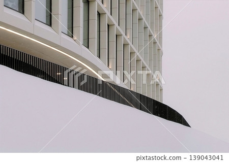 Modern building facade snowing on abstract structure Modern building facade snowing on abstract structure 139043041