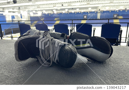hockey arm guard and skate on the ice stadium floor hockey arm guard and skate on the ice stadium floor 139043217