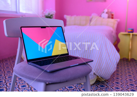 A laptop placed on a chair: Happy Pop A laptop placed on a chair: Happy Pop 139043629