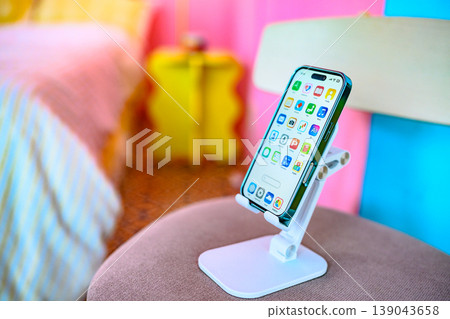 Smartphone stand in a pink and blue room: Happy Pop 139043658