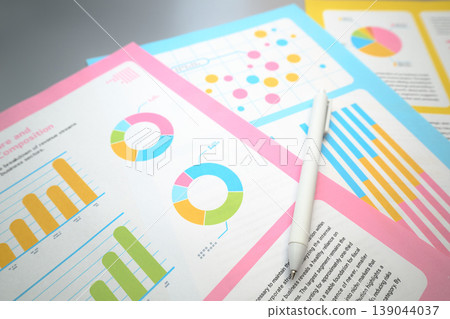 A document with a graph and a pen placed on it. A document with a graph and a pen placed on it. 139044037