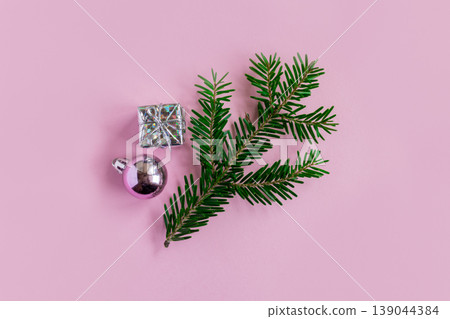 Beautiful Christmas ornaments with decorations on a pink pastel background. Beautiful Christmas ornaments with decorations on a pink pastel background. 139044384