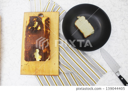 Step-by-step recipe for making cottage cheese casserole. Cut the casserole into slices, portioned pieces 139044405