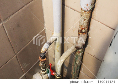 Rusty water pipes in the apartment 139044424