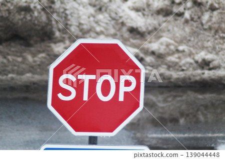 Stop sign on the background of snow Stop sign on the background of snow 139044448