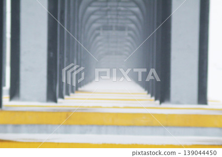 the columns of the bridge stretching into the distance. Beautiful geometry the columns of the bridge stretching into the distance. Beautiful geometry 139044450