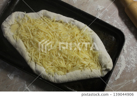 Raw Adjarian khachapuri top view Raw Adjarian khachapuri top view 139044906