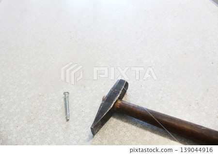 Hammer and nail with space for Tet copyspace Hammer and nail with space for Tet copyspace 139044916