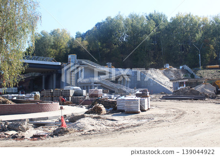 construction of a bridge across the river. Stage of construction of the exit from the bridge construction of a bridge across the river. Stage of construction of the exit from the bridge 139044922