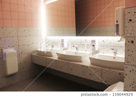 washbasin area in a public toilet. Modern design washbasin area in a public toilet. Modern design 139044929