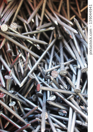 Construction nails close-up. Construction background Construction nails close-up. Construction background 139044941