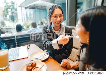 Relax two young adult asian woman talking positive friendship conversation happiness restaurant Relax two young adult asian woman talking positive friendship conversation happiness restaurant 139045068