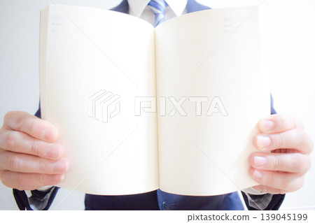 Businessman and book Businessman and book 139045199