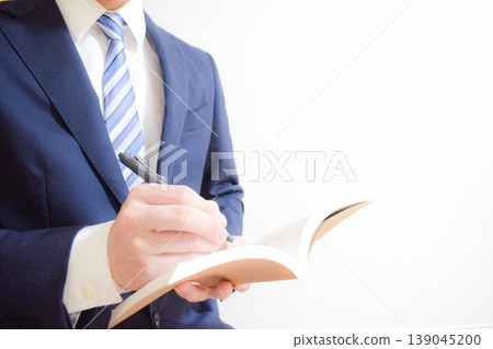 Businessman and book Businessman and book 139045200