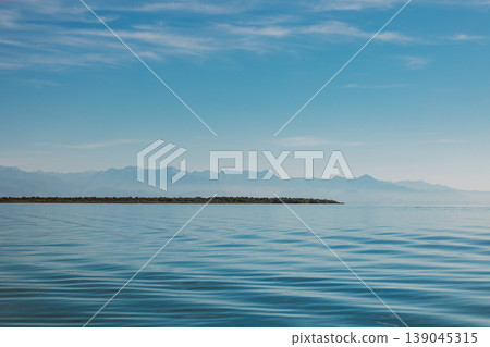Amazing view of Skadar Lake and beautiful mountains on a sunny morning. Travel destination in Montenegro. Amazing view of Skadar Lake and beautiful mountains on a sunny morning. Travel destination in Montenegro. 139045315