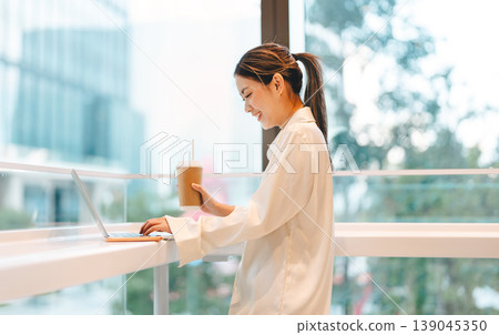 Happy smiling business young asian woman working on laptop freelance modern technology lifestyles Happy smiling business young asian woman working on laptop freelance modern technology lifestyles 139045350