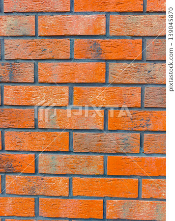 Brick wall pattern with rich colors in a close view showcasing various shades and textures, captured during daylight Brick wall pattern with rich colors in a close view showcasing various shades and textures, captured during daylight 139045870