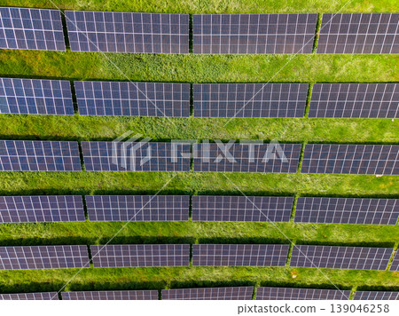 Solar panels cover a large field in a renewable energy project under bright sunlight in the afternoon Solar panels cover a large field in a renewable energy project under bright sunlight in the afternoon 139046258