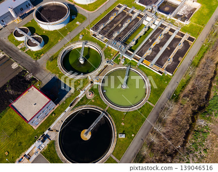 Water treatment facility operates in a city to process wastewater and clean water for the community during daytime hours 139046516