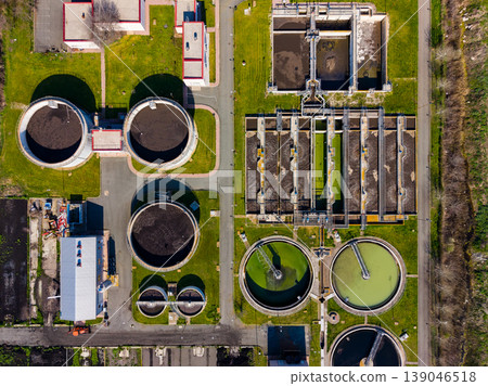 Wastewater treatment facility shows various tanks and structures for managing water safety in a clean environment during daylight hours 139046518