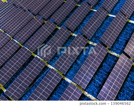 Rows of solar panels reflect sunlight in a rural area on a clear day while contributing to renewable energy generation Rows of solar panels reflect sunlight in a rural area on a clear day while contributing to renewable energy generation 139046562
