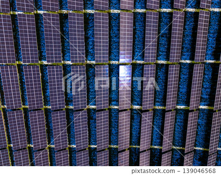 Solar panels arranged on a rooftop showing their structure and patterns under a clear sky during the daytime Solar panels arranged on a rooftop showing their structure and patterns under a clear sky during the daytime 139046568