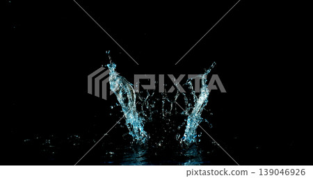 High-speed water crown splash on black background with clean central space for product placement. Dynamic droplets and dramatic lighting, ideal for advertising and compositing. High-speed water crown splash on black background with clean central space for product placement. Dynamic droplets and dramatic lighting, ideal for advertising and compositing. 139046926