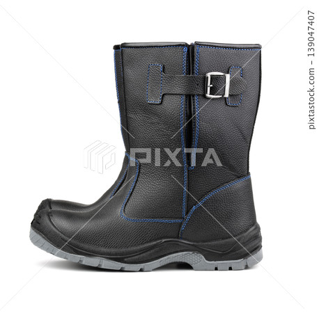 Side view of black winter work boots Side view of black winter work boots 139047407