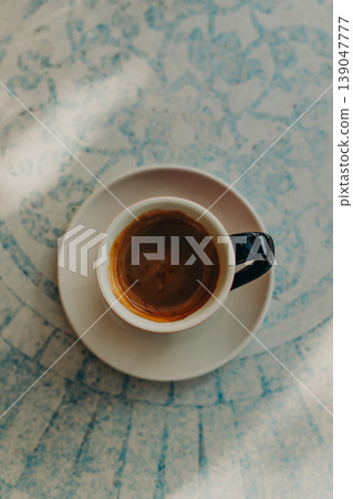 Cup of black coffee on a table in a cafe. Top view. Cup of black coffee on a table in a cafe. Top view. 139047777