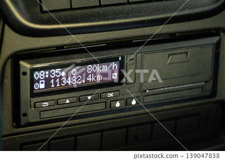 Digital tachograph device installed in truck dashboard Digital tachograph device installed in truck dashboard 139047838
