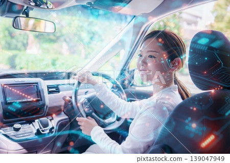A young woman driving a car with a smile A young woman driving a car with a smile 139047949