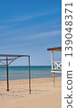 Empty beaches and preparations for the summer season and the influx of tourists, vacation on the Mediterranean Sea, vertical photo with a frame for tented 139048371