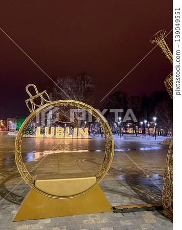 Lublin city sign illuminated at night with trees in the background Lublin city sign illuminated at night with trees in the background 139049551