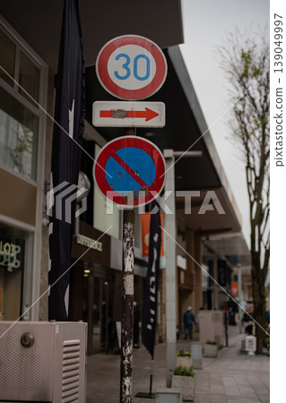 Traffic signs in a shopping street and the cityscape Traffic signs in a shopping street and the cityscape 139049997