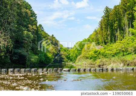 A scene of a quiet river flowing A scene of a quiet river flowing 139050063