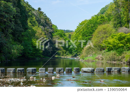 A scene of a quiet river flowing A scene of a quiet river flowing 139050064