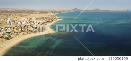Aerial view of Sal Rei beach and yacht moored in the shore Aerial view of Sal Rei beach and yacht moored in the shore 139050109