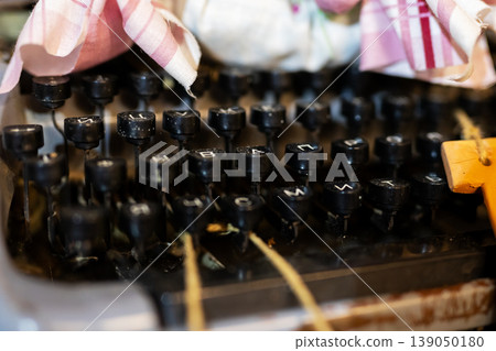 Rustic craftroom scene showcasing retro switchboard adorned with fabric bows and tangled cords 139050180