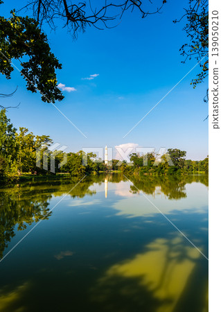 Panoramic view of lake near Lednice castle with minaret tower. Panoramic view of lake near Lednice castle with minaret tower. 139050210