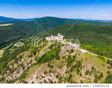 Aerial view of Cachtice castle, Slovakia. Famous medieval castle known from legends of bloody queen Bathory. Aerial view of Cachtice castle, Slovakia. Famous medieval castle known from legends of bloody queen Bathory. 139050214