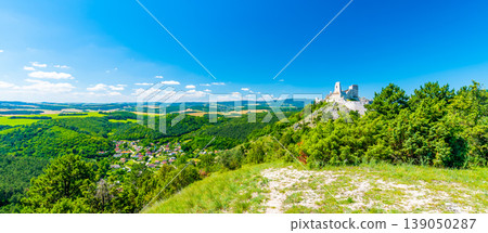 The old ruins of castle Cachtice (Cachtice in local speak). Ruined castle on top of hill at Slovakia. Famous and mysterious place known from legend of blood lady Bathory. Summer day, panorama view. 139050287