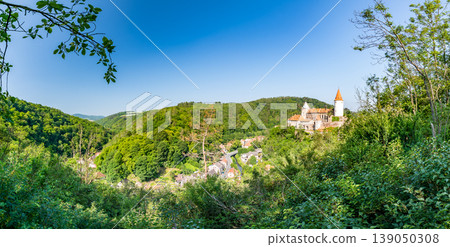 Panorama view of medieval castle Krivoklat, Czech Republic. Sunny day during summer, fresh forest near the castle. Panorama view of medieval castle Krivoklat, Czech Republic. Sunny day during summer, fresh forest near the castle. 139050308